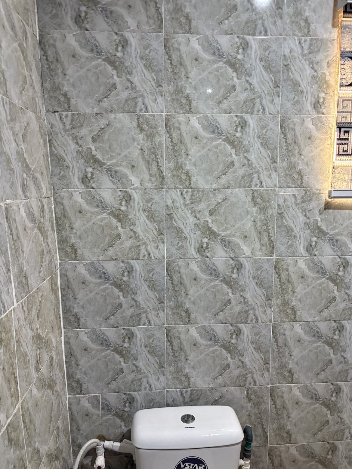 Stone-tiled bathroom wall detail