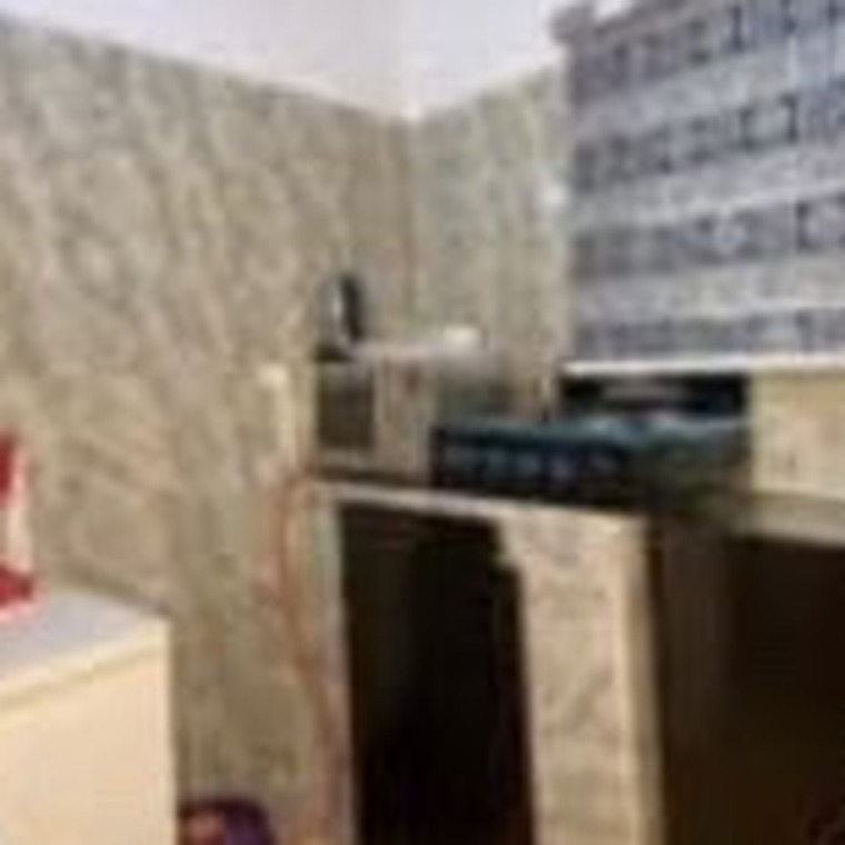 Kitchenette with cooker and microwave