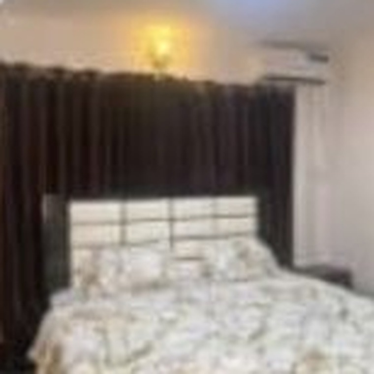 Double bed with patterned linen
